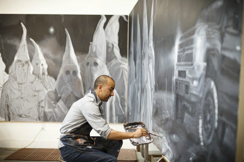 Mexican American artist, Vincent Valdez works on an eight panel painting of modern day klansmen, in his studio in San Antonio, Friday, February 27, 2016. (Photo by Michael Stravato)