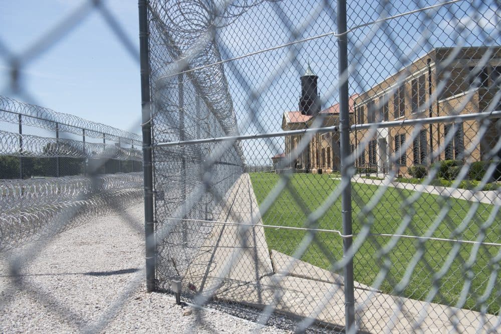 Fences and barbed wire at the entrance of the El Reno Federal Correctional Institution in El Reno, Okla., July 16, 2015. (Saul Loeb/AFP/Getty Images)