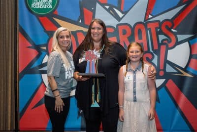 Emily Ross (center) with her daughter, Morgan, after receiving her GED in July 2017. (Courtesy LeBron James Family Foundation)