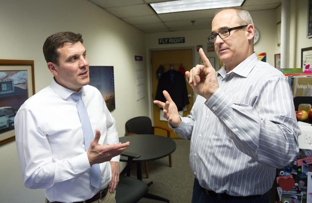 Instructors Todd Czubek, left, and Bruce Bucci are in conversation at Czubek's office in Boston. (Robin Lubbock/WBUR)