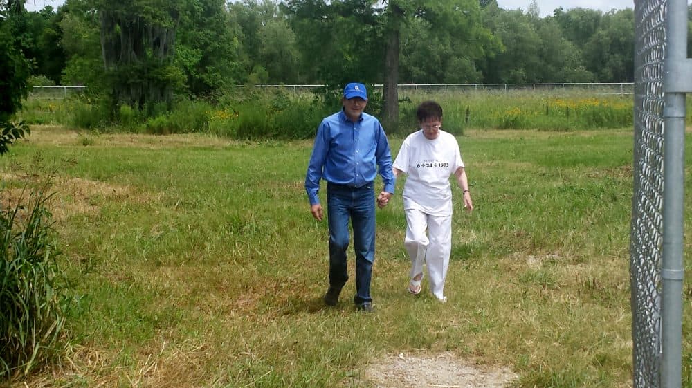 Skip and Marilyn walking through the potter's field where Ferris is buried. (Courtesy Lori Bailey)