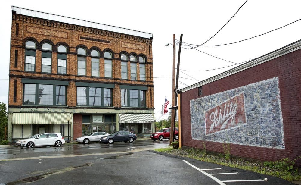 The Schlitz banner, painted for &quot;Castle Rock,&quot; still adorns a wall in Orange. (Robin Lubbock/WBUR)