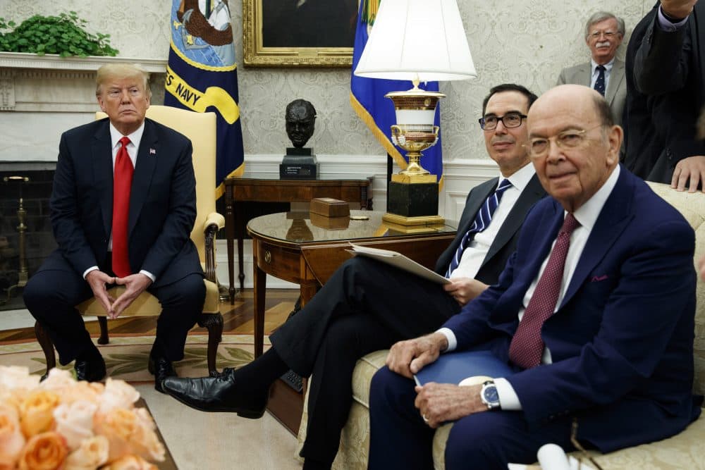 President Donald Trump sits with Secretary of Commerce Wilbur Ross, right, and Treasury Secretary Steve Mnuchin, center, during a meeting with European Commission president Jean-Claude Juncker in the Oval Office of the White House, Wednesday, July 25, 2018, in Washington. National security adviser John Bolton listens at top right. (Evan Vucci/AP)