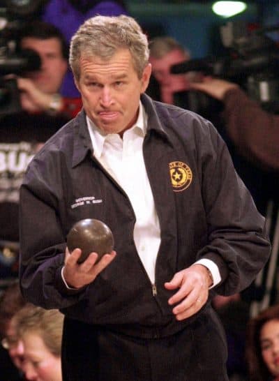 Then-Gov. George W. Bush tried his hand at the storied American pastime while on the campaign trail in 2000. (Eric Draper/AP)