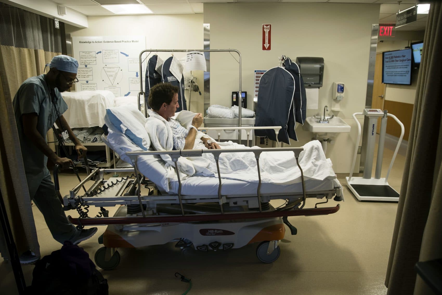 Ryan Ciccozzi is taken to surgery at the Hospital of the University of Pennsylvania in Philadelphia, Tuesday, Jan. 23, 2018. During Ciccozzi's surgery a fluorescent dye was used to find hidden cancer cells near his heart and in a lung. Surgery has long been the best way to cure cancer. Now, dyes are being tested to make cancer cells light up so doctors can cut them out and give patients a better shot at survival. (AP Photo/Matt Rourke)