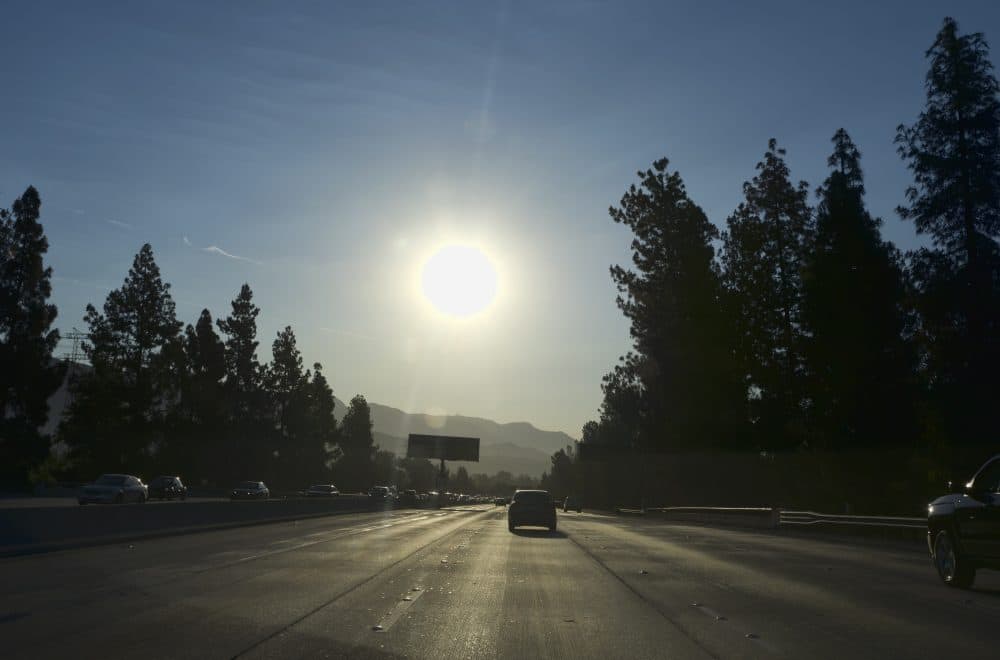 A strong morning sun rises over the Ventura Freeway State Route 134 in Burbank, Calif. on Friday, July 6, 2018. Forecasters say temperatures will soar into triple digits throughout almost all of Southern California as a brief but intense heat wave broils the region. (Richard Vogel/AP)