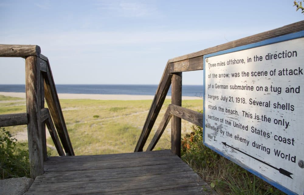 In this July 14, 2014, photo, taken at Nauset Beach in Orleans, a sign informs visitors of a German World War I submarine attack off the shore, in 1918. (Virginia Mayo/AP)