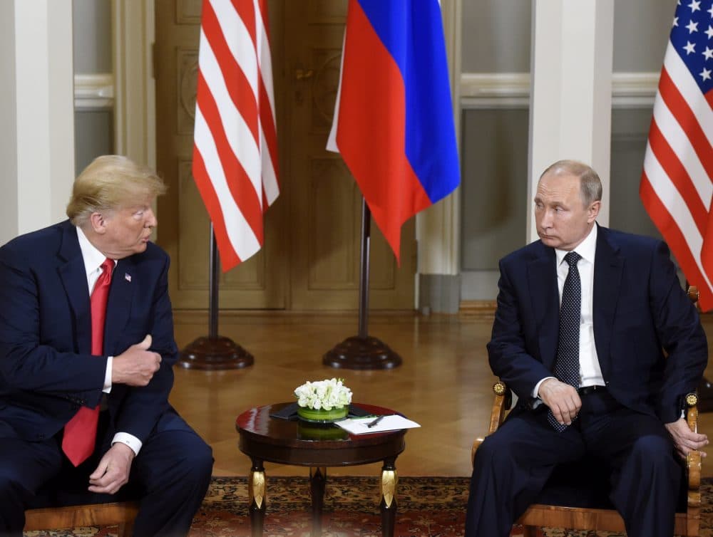 U.S. President Donald Trump, left and Russian President Vladimir Putin talk during their meeting in the Presidential Palace in Helsinki, Monday, July 16, 2018. (Heikki Saukkomaa/Lehtikuva via AP)