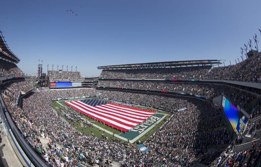 Many NFL teams have incorporated extensive patriotic displays in their pregame routines. (Mitchell Leff/Getty Images)