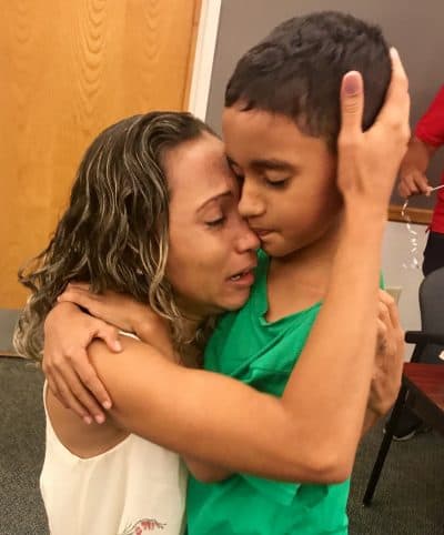 A Brazilian woman is reunited with her 9-year-old son in Boston after 45 days apart. (Lawyers’ Committee for Civil Rights and Economic Justice)