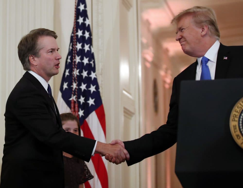 President Trump shakes hands with Judge Brett Kavanaugh his Supreme Court nominee, in the East Room of the White House on Monday. (Alex Brandon/AP)