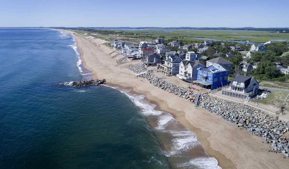 At the southern end of the inhabited section of Plum Island, a rock barrier has been constructed between many of the houses and the ocean. (Robin Lubbock/WBUR)