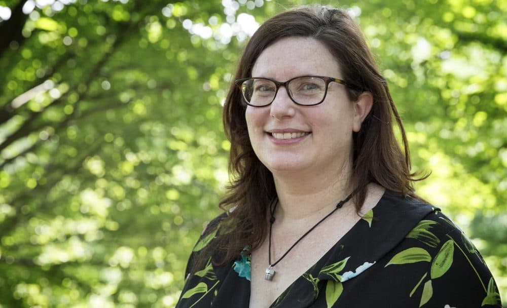 Karen Mauney-Brodek, president of the Emerald Necklace Conservancy, is wearing one of Nakaya's specially-designed nozzles on her necklace. (Robin Lubbock/WBUR)