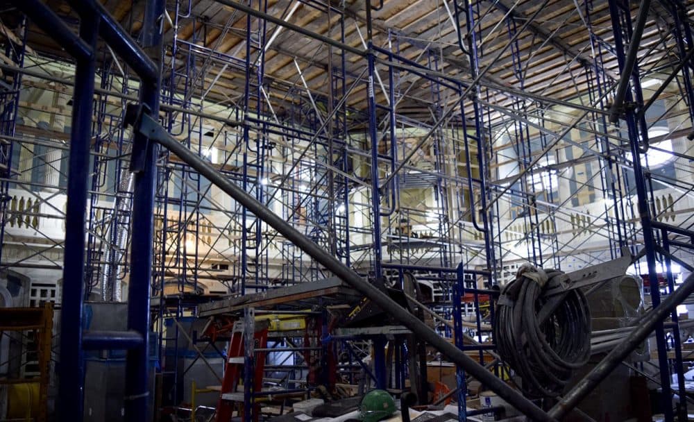 Scaffolding holds up a temporary platform inside the historic Senate Chamber, located directly under the golden dome of the State House. The chamber is undergoing a $23 million renovation. (Steve Brown/WBUR)
