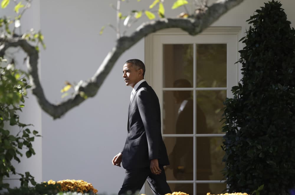 President Barack Obama walks from the Oval Office and across the South Lawn of the White House in Washington, Friday, Oct. 28, 2016, before boarding Marine One helicopter for the short flight to Andrews Air Force Base, Md., en route to Florida to speak at a Hillary for America campaign event. (Carolyn Kaster/AP)
