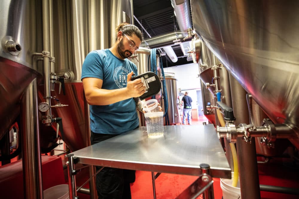 Adam Denny Golab works on his brew at the Bent Water Brewing Company. (Courtesy Bob Packert/Peabody Essex Museum)