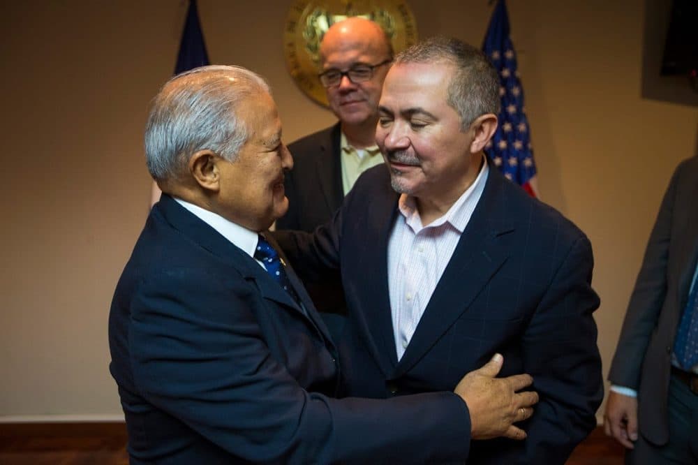 El Salvador President Salvador Sánchez Cerén greets Oscar Chacón of Alianza Americas as Congressman Jim McGovern watches at the Casa Presidencial in San Salvador. (Jesse Costa/WBUR)