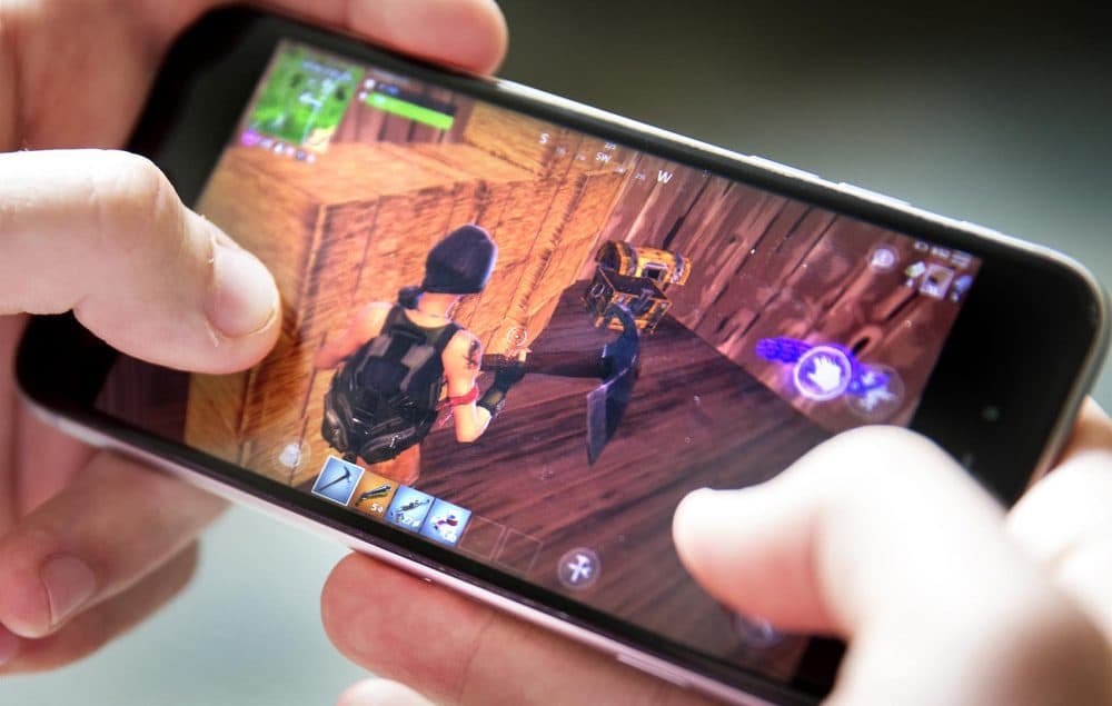 A player finds a treasure chest in the online game &quot;Fortnite.&quot; (Robin Lubbock/WBUR)