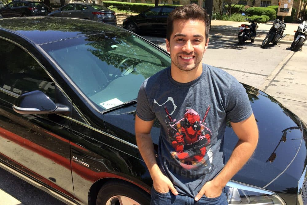 Paul Christian with his car in Austin. (Ashley Bailey/Here &amp; Now)