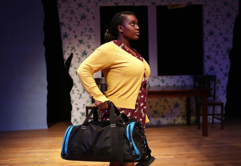Tenneh Sillah of Roslindale goes through a scene during rehearsal for &quot;This Placed / Displaced&quot; at the Charlestown Working Theater. (Hadley Green for WBUR)