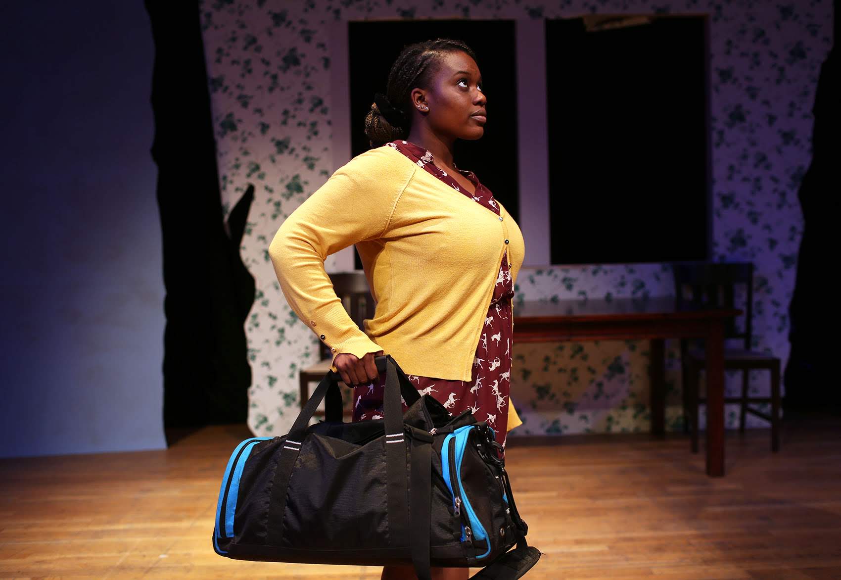 Tenneh Sillah of Roslindale goes through a scene during rehearsal for "This Placed / Displaced" at the Charlestown Working Theater. (Hadley Green for WBUR)