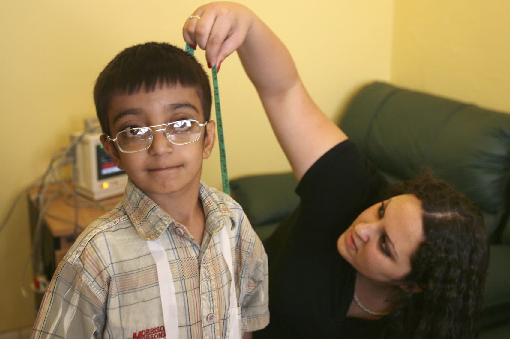 Israeli Dr. Raneen, right, measures the height of an Iraqi boy at the Red Crescent hospital in Amman, Jordan on Tuesday, Oct. 9, 2007. Three Israeli doctors on Tuesday screened 40 Iraqi children suffering from heart disease in a rare instance of direct cooperation between the Jewish state and the Arab country. The doctors said they hoped their actions will improve relations between the two Mideast nations and ease tensions between Israel and the rest of the Arab world. (AP Photo/Nader Daoud)