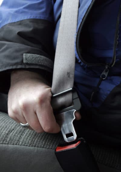 A person buckles up in Bethel, Maine in 2008. (Pat Wellenbach/AP)