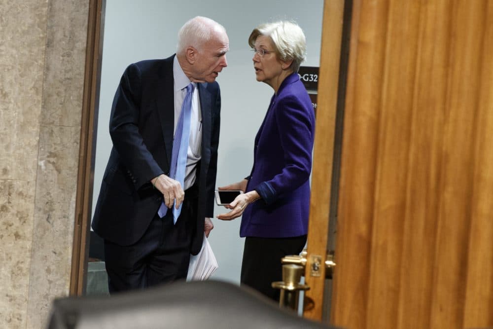 Senate Armed Services Committee Chairman Sen. John McCain, R-Ariz., left, talks with Sen. Elizabeth Warren, D-Mass. on Capitol Hill in Washington, Thursday, Jan. 5, 2017. (Evan Vucci/AP)