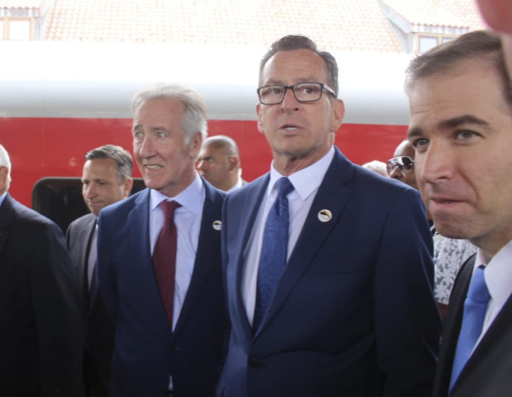 U.S. Rep. Richard Neal, left, is greeted on the platform at Hartford's Union Station on June 15 by Connecticut Gov. Dannel Malloy and Hartford Mayor Luke Bronin. Neal traveled by train from Springfield and Malloy traveled from New Haven to mark the opening of the Hartford Line, a new commuter rail line linking the three cities. (Pat Eaton-Robb/AP)