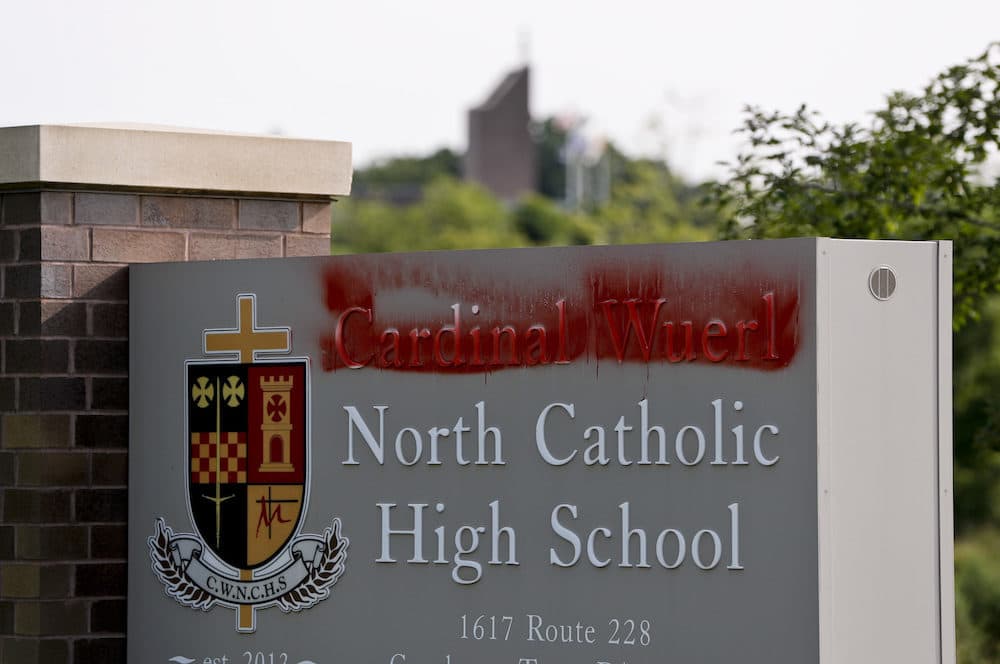 Paint covers the name of Cardinal Wuerl at Cardinal Wuerl North Catholic High School, on Monday, Aug. 20, 2018, in Cranberry Township, Pa. Wuerl, a Roman Catholic Cardinal, and the archbishop of Washington, D.C., has come under fire from revelations in the Pennsylvania grand jury report about his actions while bishop of Pittsburgh. (Keith Srakocic/AP)
