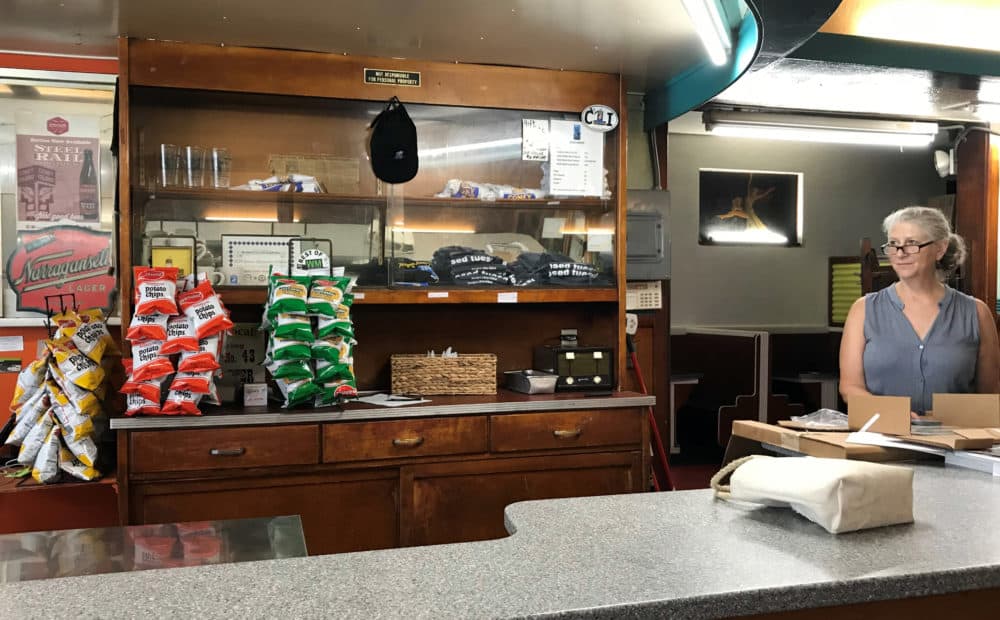 Kathryn Tsandikos, owner of George's Coney Island Hot Dogs, has mixed feelings about the prospect of a AAA baseball team moving to Worcester. (Callum Borchers/WBUR)