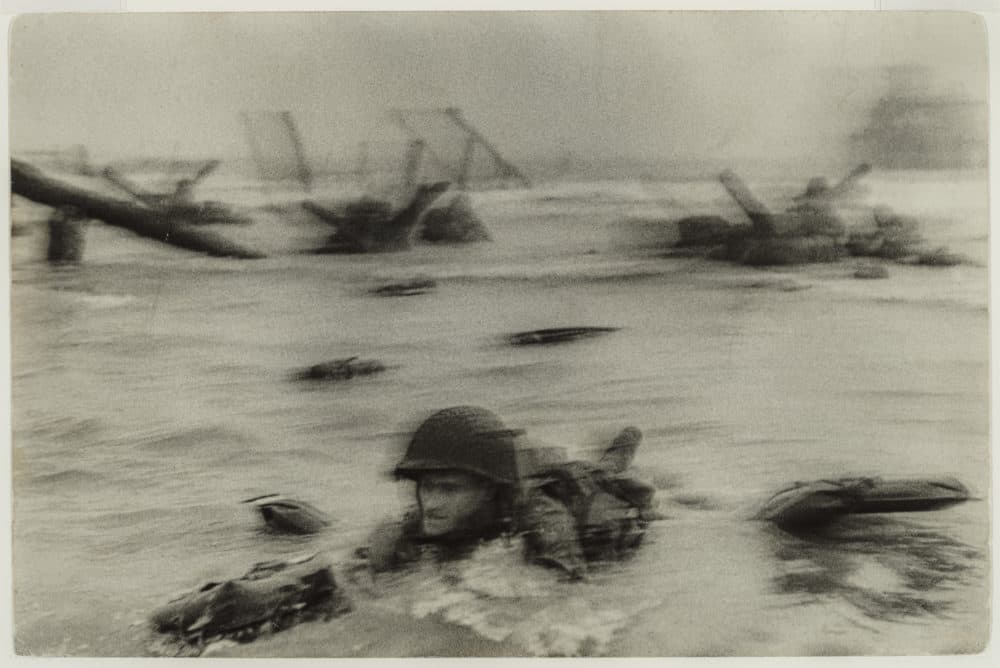 Robert Capa's photograph of the Normandy invasion on D‑Day. (Courtesy The Howard Greenberg Collection, MFA Boston)