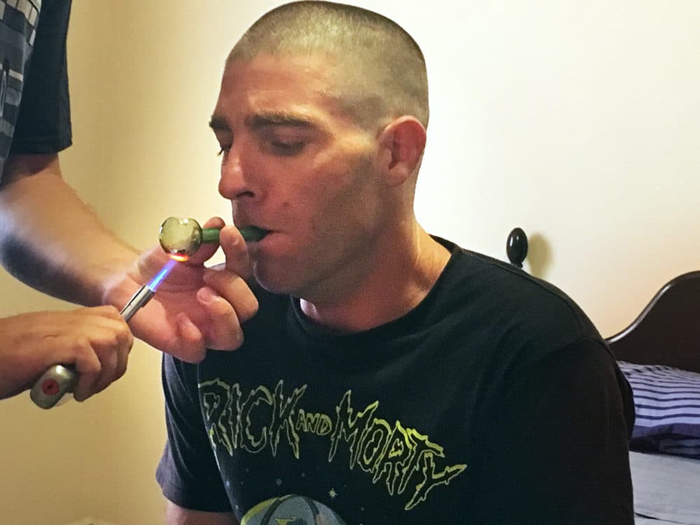 Three days after taking ibogaine, Dustin Dextraze inhales a dose of 5 MEO-DMT, a powerful psychedelic used by Experience Ibogaine Treatment Center in Mexico as a supplemental treatment. (Deborah Becker/WBUR)