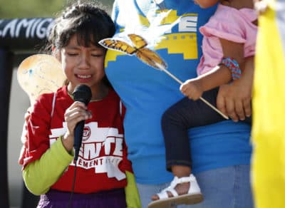 Akemi Vargas, 8, cries as she talks about being separated from her father at the border during an immigration family separation protest in front of the Sandra Day O'Connor U.S. District Court building on June 18 in Phoenix. (Ross D. Franklin/AP)