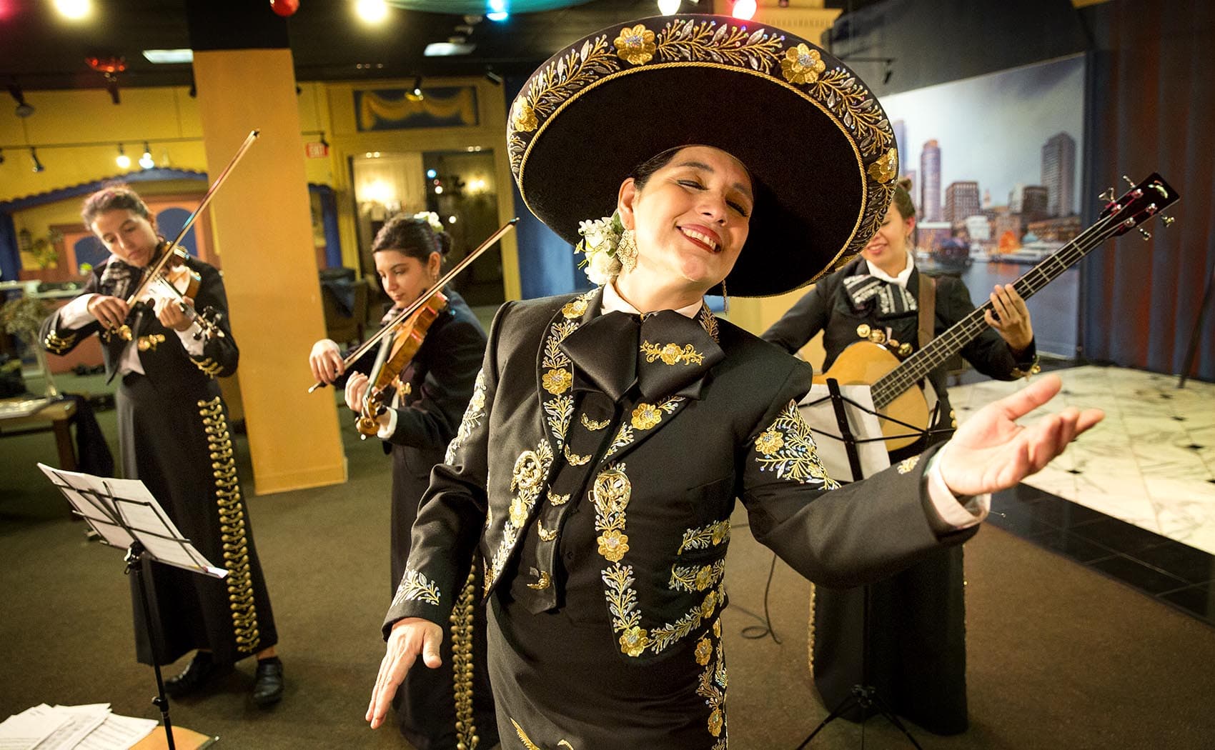 Veronica Robles rehearsing with her mariachi band in East Boston. (Robin Lubbock/WBUR)