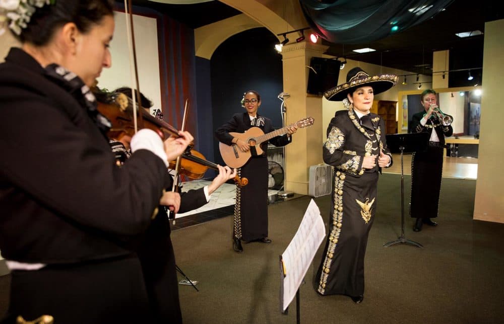 Veronica Robles rehearsing with her mariachi band in East Boston. (Robin Lubbock/WBUR)