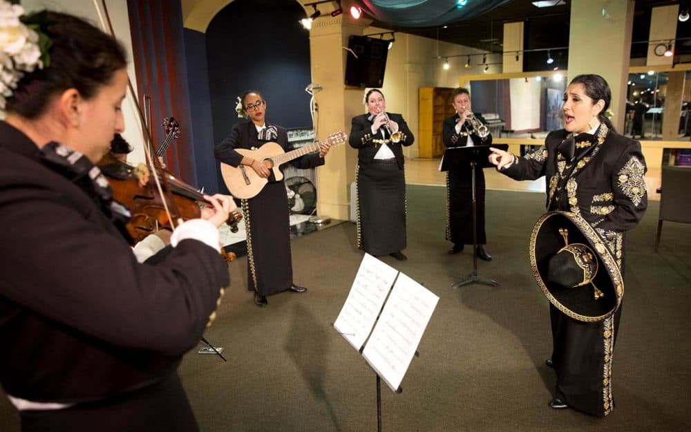 Veronica Robles rehearsing with her mariachi band in East Boston. (Robin Lubbock/WBUR)