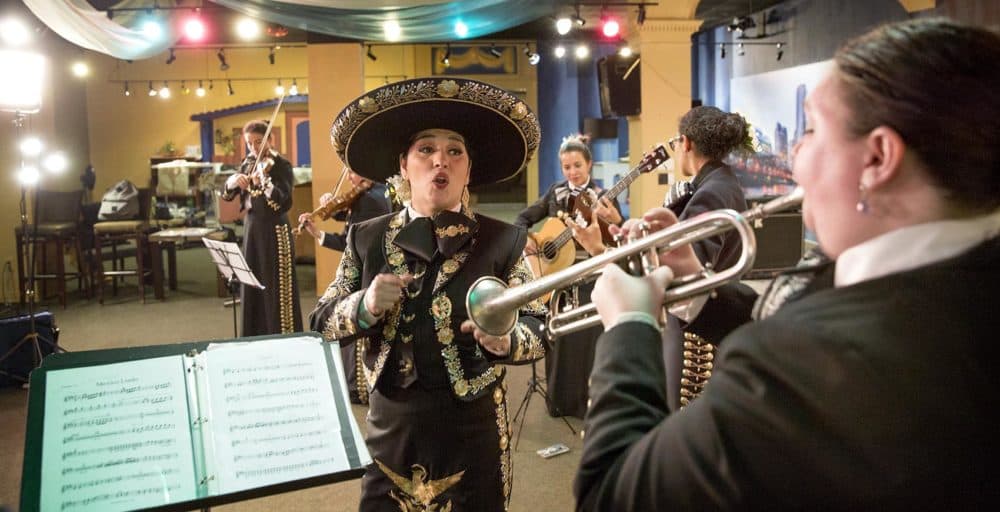 Veronica Robles rehearsing with her mariachi band in East Boston. (Robin Lubbock/WBUR)