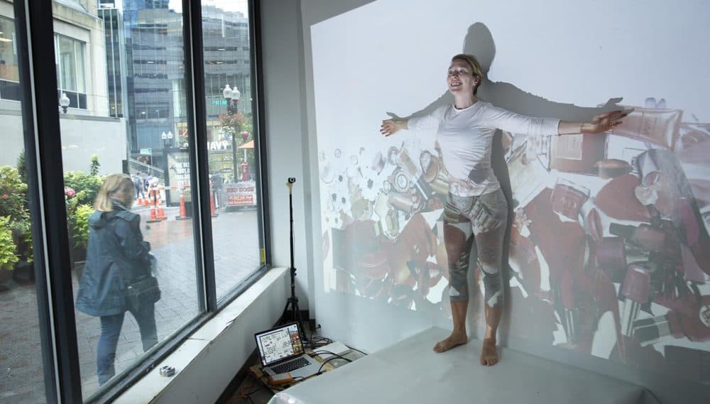 Artist Catherine Siller rehearses &quot;Are You Buying?&quot; (Robin Lubbock/WBUR)