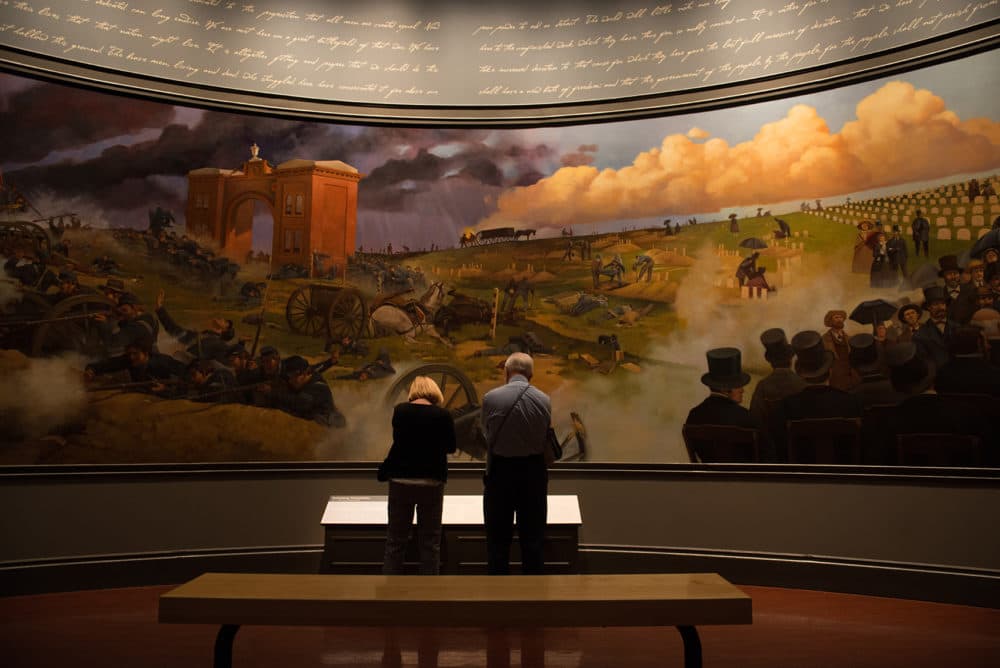 Visitors view the Gettysburg Address and Battle mural at the Abraham Lincoln Presidential Library and Museum in Springfield, Ill. (Neeta Satam for Here &amp; Now)