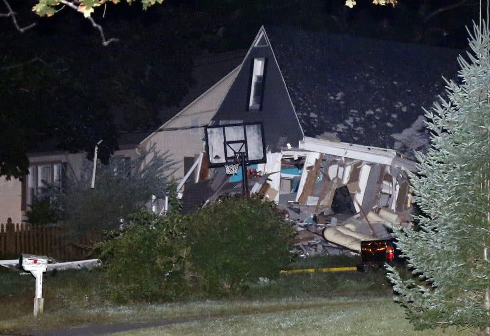 A house is destroyed in Lawrence, Mass. A problem with a gas line that feeds homes in several communities north of Boston triggered a series of gas explosions and fires. (Mary Schwalm/AP)
