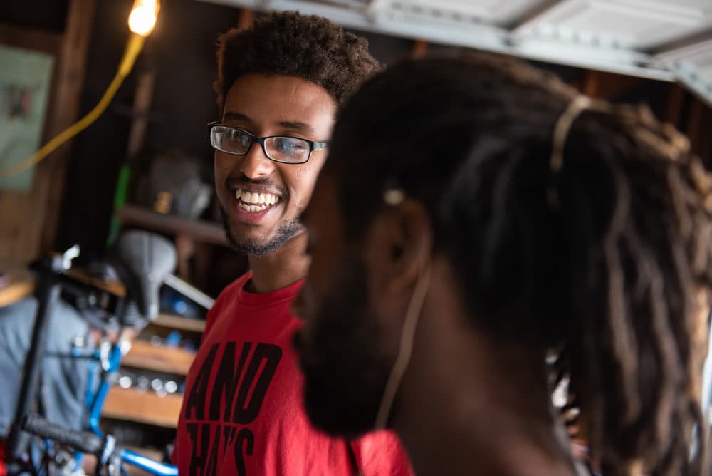 Samson Tarefe, left, laughs as he chats with Antonio Ballard, right, in The Biker Boyz &amp; Girlz Shop in Indianapolis. (Lucas Carter for Here &amp; Now)