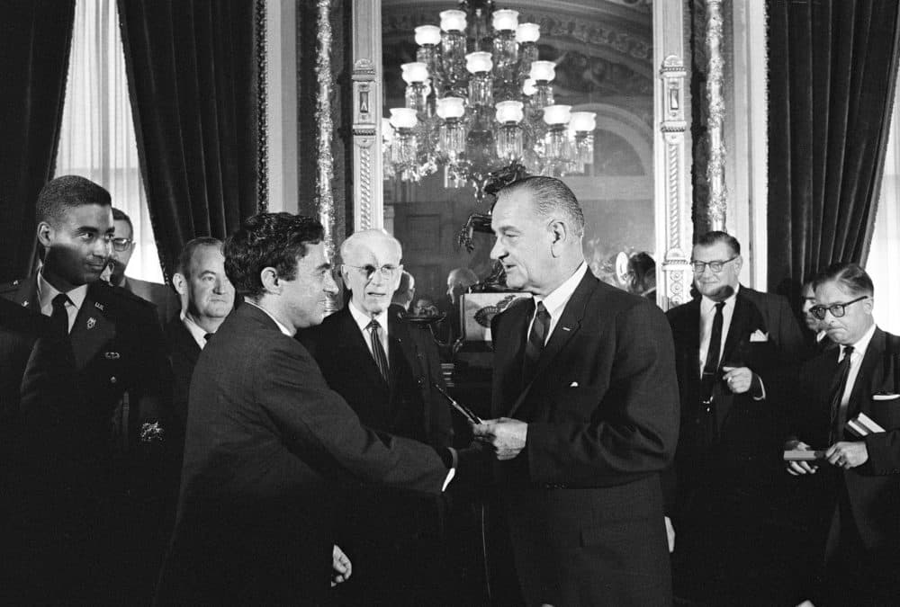 Richard Goodwin receives the pen that signed the Voting Rights Act from President Lyndon Johnson on Aug. 6, 1965. (Courtesy)