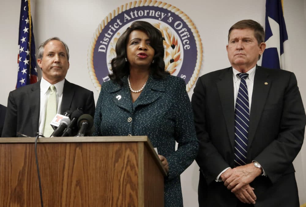 Texas Attorney General Ken Paxton, from left, Dallas County District Attorney Faith Johnson, center, and 1st Dallas County Assistant District Attorney Mike Snipes, right, address the media during a news conference, June 22, 2017, in Dallas. (Tony Gutierrez/AP)