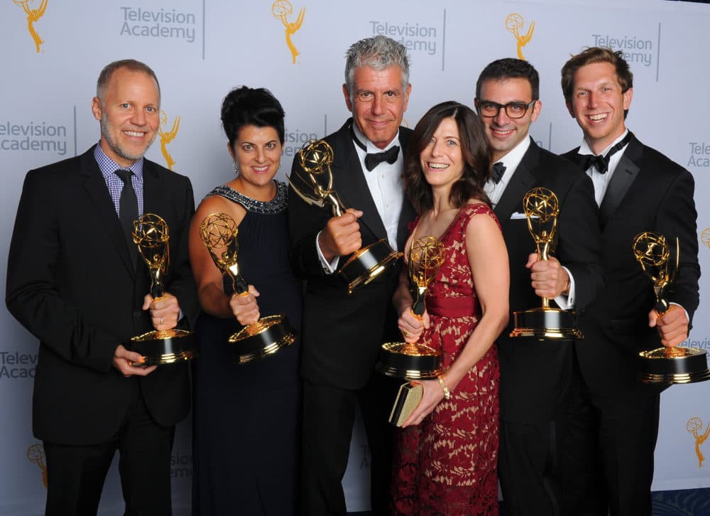 Chris Collins, from left, Lydia Tenaglia, Anthony Bourdain, Sandra Zweig, Tom Vitale and Erik Osterholm, winners of the award for outstanding informational series or special for &quot;Anthony Bourdain: Parts Unknown,&quot; pose for a portrait at the Television Academy's Creative Arts Emmy Awards on Sept. 12, 2015, in Los Angeles. (Vince Bucci/Invision for the Television Academy/AP)