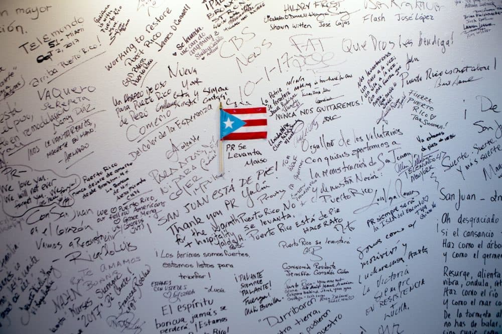 A wall with well wishes to Puerto Rico in the entrance of the Roberto Clemente Coliseum in San Juan. Carmen Yulín Cruz, the city's mayor, stayed here for 2 months while it was being used as a shelter during the initial relief efforts after Hurricane Maria. She considers this building inspirational and makes this her preferred place to conduct city business as opposed to City Hall. (Jesse Costa/WBUR)