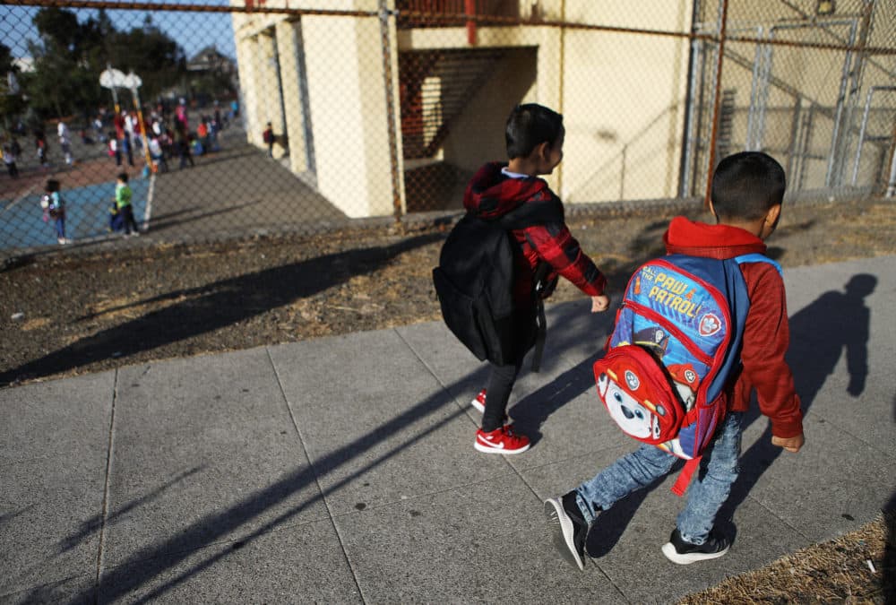 Honduran 6-year-old Anthony (right) walks to school on Sept. 10, 2018 in Oakland, Calif. He and his father Juan fled their country, leaving many family members behind, and crossed the U.S. border in April at a lawful port of entry in Brownsville, Texas, seeking asylum. They were soon separated and spent the next 85 days apart in detention. Juan was sent to Tulsa, Oklahoma, while his son was sent to a detention shelter New York. They were one of almost 2,600 families separated due to the Trump administration's &quot;zero tolerance&quot; immigration policy. (Mario Tama/Getty Images)