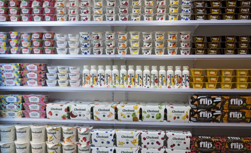 In this Monday, Nov. 20, 2017 photo, Chobani yogurt cups are displayed in New York. Chobani, the company that helped kick-start the Greek yogurt craze, is shrinking those words from its label as it hints it may expand beyond that food in an increasingly crowded yogurt market. (AP Photo/Mark Lennihan)