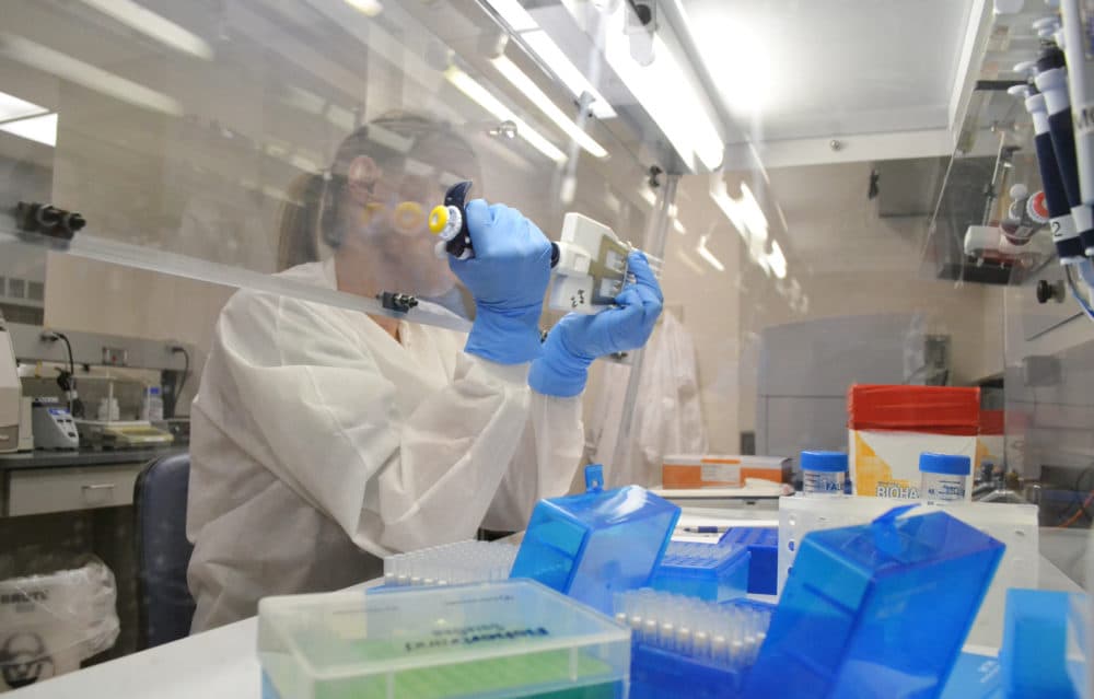 In this April 12, 2018 photo lab technician extracts DNA for whole genome sequencing at the Colorado Department of Public Health &amp; Environment’s Molecular Science Laboratory in Denver. Some experts say the new DNA testing is revolutionizing the way disease detectives to identity and solve food poisoning outbreaks. (AP Photo/P. Solomon Banda)