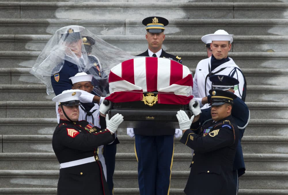 The flag-draped casket of Sen. John McCain, R-Ariz., is carried by an Armed Forces body bearer team, down the steps of the U.S. Capitol, Saturday, Sept. 1, 2018, in Washington. (Jose Luis Magana/AP)